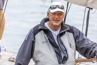 Celebrity participant is King Harald V of Norway as helmsman Sira. Sailing on Lake Constance