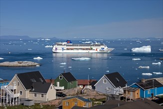 Cruise ship in bay in front of the town Ilulissat