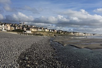 View over the chalk cliffs and the village Ault seen from the pebble beach