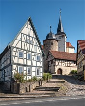 Half-timbered houses and stairway to the church castle