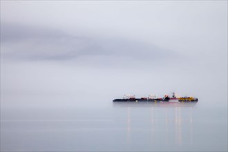 Cargo ship in the fog of Valdez Bay