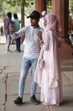 Young Indian couple taking a selfie photo at Diwan i Am