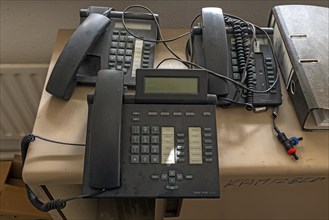 Phones left behind in an office of a former paper factory