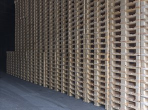 Stacked euro pallets in a former paper factory