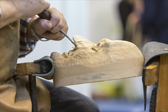 Maskenschnnitzer works on a wooden mask for a Swabian-Alemannic Fasnet figure