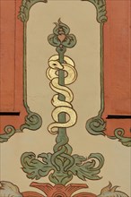 Rod of Asclepius with snake figure as a mural on the historic Deer Pharmacy