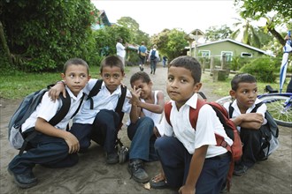Schoolchildren in uniforms on the main street of Tortuguero