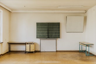 A blackboard in an empty classroom of the old primary school in Trinwillershagen