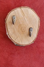Coat hook on wooden disc