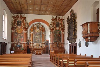 Interior view with pulpit and altar of the baroque monastery church Loretokapelle