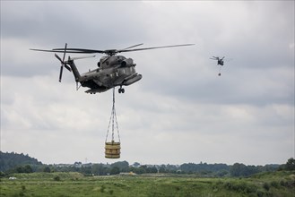 Two Bundeswehr helicopters with fire extinguishing tank 5000 litres