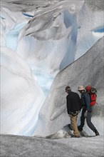 Tourists walking on the Perito Moreno glacier in the Los Glaciares National Park