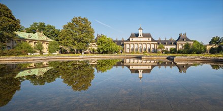 The central palace of Pillnitz Palace in the Elbe Valley reflected in water basin