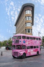 Pink double-decker bus in Vancouver