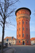 Red water tower built 1920 with bricks