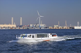 Yokohama Port cruising water-bus Seabass and Yokohama City Wind Power Plant Hama Wing seen in the background Kanagawa Japan