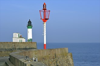 Lighthouse and marine beacon on jetty at Le Treport