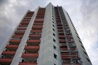 High-rise residential building with scaffolding in Hohenschoenhausen