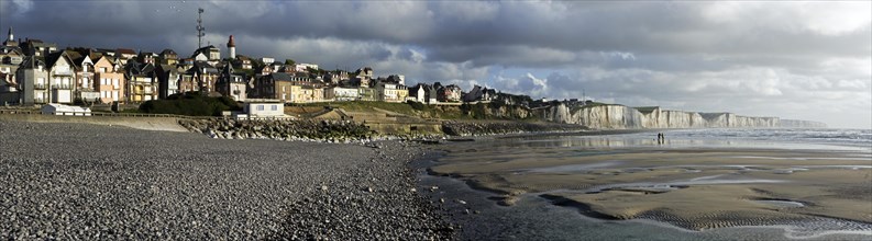 View over the chalk cliffs and the village Ault seen from the pebble beach