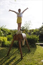 Girl gymnastics on a wooden horse