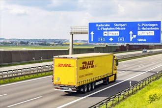 DHL truck on the road on the motorway at the airport