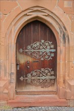 Door with decoration and fittings