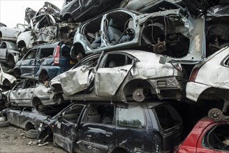 Crushed cars in scrap yard UK