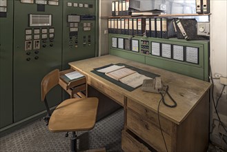 Work table with microphone in the control room of a former paper factory