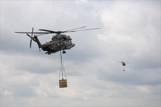 Two Bundeswehr helicopters with fire extinguishing tank 5000 litres