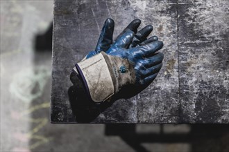 Work gloves lying on a worktop