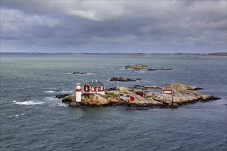 Lighthouse Gaeveskaer on small rocky island in the Kattegat