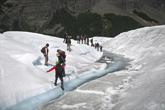 Tourists walking on the Perito Moreno glacier in the Los Glaciares National Park