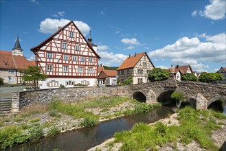 Half-timbered houses and medieval stone bridge