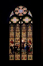 Stained glass window with Martin Luther's posting of 95 theses at the castle church in Wittenberg