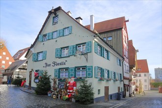 Restaurant Zur Forelle with Christmas decoration and green shutters