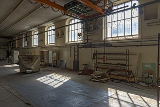 Cleared-out production hall of a paper factory
