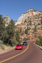 Red VW bed on the panoramic Zion-Mt.Carmel Highway through bizarre rocky landscape