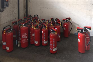 Discarded fire extinguishers in a former paper factory