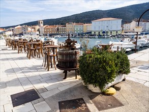Harbour promenade with restaurant tables