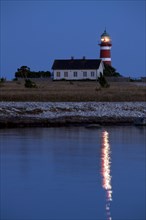 The red and white lighthouse Naers fyr at Naersholmen on the island Gotland