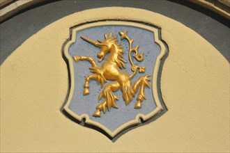 City coat of arms with golden unicorn on the town hall
