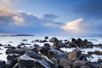 Blue hour dawn on a rocky beach near Reiff on the west coast of Scotland