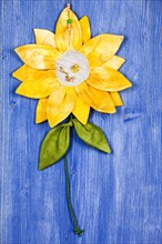 Fabric sunflower on blue background