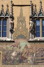 Ulm Town Hall with ornate windows with elector figures and facade with murals