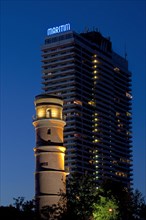 Maritim Hotel and the old lighthouse in the port of Travemuende at night