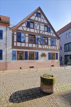 Half-timbered house with blue shutters in Lange Gasse