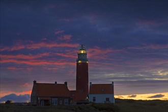 Eierland Lighthouse in the dunes at sunset on the northernmost tip of the Dutch island of Texel