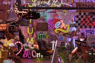 Room full of bright colourful neon signs