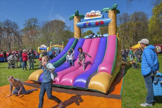 Inflatable plastic slide in springtime Luitpoldpark