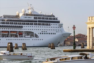 A cruise ship is heading for the Stazione Marittima cruise terminal. Meanwhile